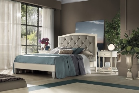 letto testata in  pelle finitura capitonnè